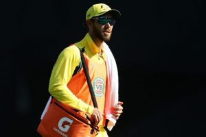 Influential: Glenn Maxwell carries the drinks at the SCG on Sunday. 