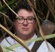 George Christensen Federal Member for Dawson for the LNP in a sugar cane field with his grandfather?s cane knife near ...