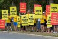 Local residents conduct a protest march against the proposed development at old QUT site in Carseldine on Saturday.