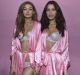 Sisters Gigi and Bella Hadid pose backstage prior to the 2016 Victoria's Secret Fashion Show in Paris.