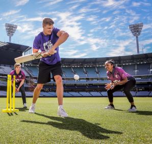 Nick Riewoldt has a hit as Gemma Triscari, Emma Inglis, Jess Cameron and Alana King field at the MCG on Friday.