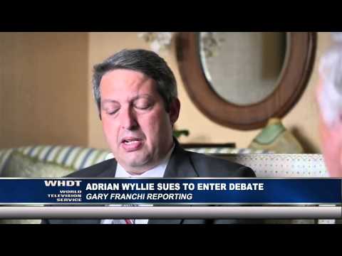 Adrian Wyllie Sues to Enter Debate