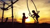 Children playing on playground equipment