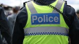 Police officers watch over the crowds at the Melbourne Cup.