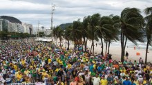 Protesters march on Rio's Copacabana beach in Brazil