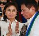 Vice-President Leni Robredo applauds as new Philippines President Rodrigo Duterte walks to address the troops during a ...