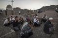 Uighur men perform prayers for the Islamic festival of Eid al-Adha in Turpan County, Xinjiang, in September.