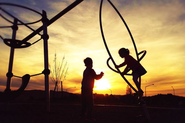 Children playing on playground equipment