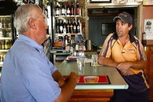 Builder-turned-publican Josh Corrigan chats with a local at the Doodle Cooma Arms (ABC)