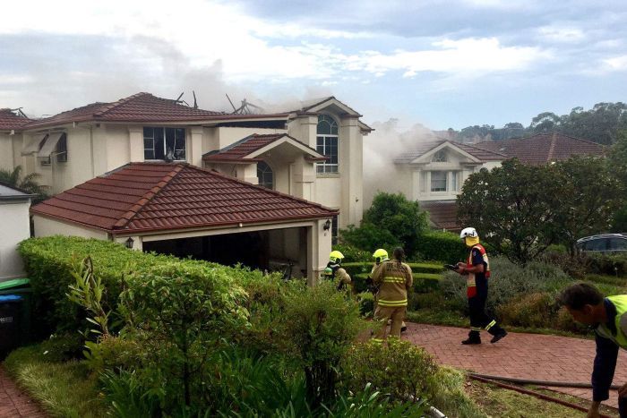 Firefighters battling a house fire.