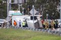 The truck rolled over at Blackburn Road on-ramp causing traffic chaos on the Monash Freeway.