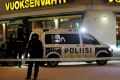 Police guard the area where three people were killed in a shooting outside a restaurant in Imatra, Finland on Sunday morning.