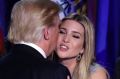 President-elect Donald Trump kisses his daughter Ivanka Trump after giving his acceptance speech during his election ...