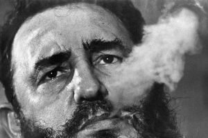 Fidel Castro exhales cigar smoke during a March 1985 interview at his presidential palace in Havana. 