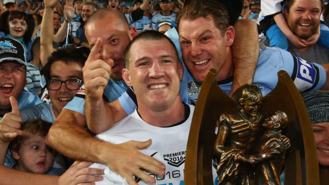 Leader: Paul Gallen is mobbed by Sharks fans after the NRL grand final.