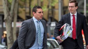 Former policeman Brendan Nolan (in checked shirt and striped tie) outside court in October.