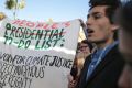 Environmental activists hold a banner during a protest against President-elect Donald Trump at the Climate Conference, ...