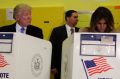 Republican presidential candidate Donald Trump looks at his wife Melania as they cast their votes.