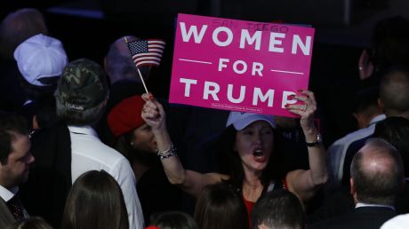 An attendee holds a "Women For Trump" sign during an election night party for U.S. President-elect Donald Trump at the ...