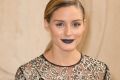 Olivia Palermo attends the Christian Dior show as part of the Paris Fashion Week rocking a chic navy lip.