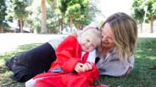 Natalie and Lila Dillenbeck who will turn 3 this month, promoting the Santa Fun Run, in Centennial Park. 