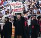 Graduating student Andrea Lorei, who helped organise campus demonstrations following the Brock Turner case, holds a sign ...