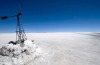 A tourist walks near the steam let off from fumaroles at the Uyuni salt flats, Bolivia.