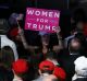 An attendee holds a "Women For Trump" sign during an election night party for U.S. President-elect Donald Trump at the ...