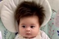 "As a bald man, I'm very proud of my 2-month-old's hair," Alexandra's dad wrote.