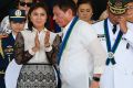 Vice-President Leni Robredo applauds as new Philippines President Rodrigo Duterte walks to address the troops during a ...