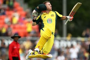 Master class: David Warner leaps in the air after posting a century.