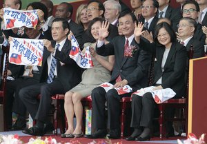 Taiwan's President Tsai Ing-wen, from right, Legislative Speaker Su Jia-chyuan, and former Taiwanese President Ma Ying-jeou, left, wave to attendants during National Day celebrations in front of the Presidential Building in Taipei, Taiwan, Monday, Oct. 10, 2016.