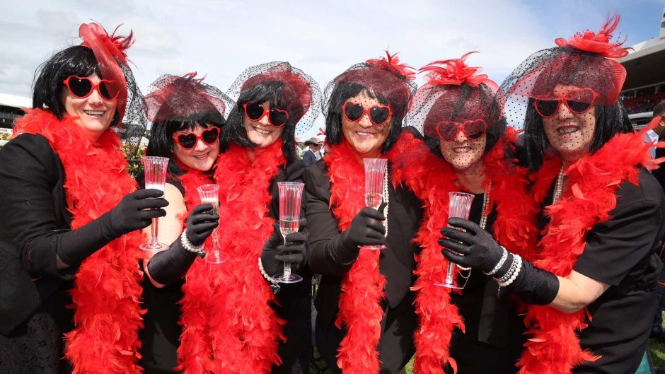 Long-term friends from western Victoria pose for the camera at the Melbourne Cup