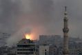 Fire rises following a Syrian government air strike that hit rebel positions in eastern Aleppo on Monday.