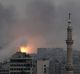 Fire rises following a Syrian government air strike that hit rebel positions in eastern Aleppo on Monday.