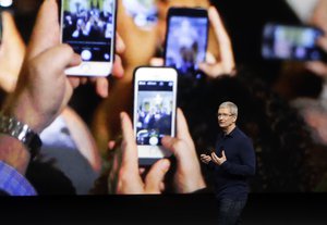 Apple CEO Tim Cook announces the new iPhone 7 during an event to announce new products Wednesday, Sept. 7, 2016, in San Francisco.