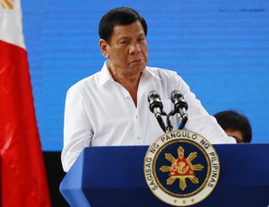 Philippine President Rodrigo Duterte reacts as he delivers his speech during the Urban Poor Solidarity Week in Mandaluyong city, east of Manila, Philippines on Wednesday, Dec. 7, 2016.