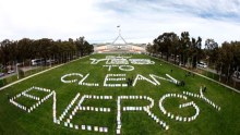 Carbon tax supporters share their message on the lawns of Parliament House.