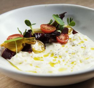 Stracciatella with beets and tomatoes at Kindred in Sydney.