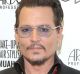 Johnny Depp, pictured on February 20, 2016, previously had a tattoo of the word "SLIM", a nickname for Heard on his ...