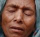 Sufia Begum, a Rohingya who recently crossed over to Bangladesh, cries on December 2 as she describes her experiences in ...