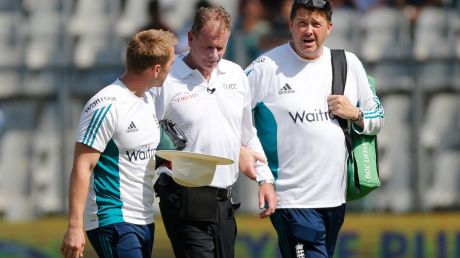 Reiffel, centre, is helped by the England team's support staff as he leaves the field for treatment.