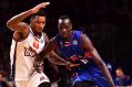 Brisbane's Torrey Craig blocks the run of Adelaide's Eric Jacobsen at the Adelaide Entertainment Centre.