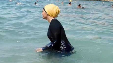 Nesrine Kenza enjoys swimming in her burkini in Marseille, France where dozens of local authorities banned its use, only ...