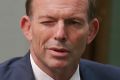 Former Prime Minister Tony Abbott winks leaving Question Time.