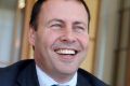 Energy Minister Josh Frydenberg must feel like he has copped a Jean-Claude Van Damme roundhouse kick.