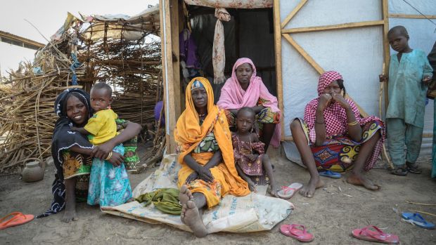 A family at Goni Kachallari in Maiduguri. They are one of 17,700 families in Borno who receive a monthly ration of oil, ...