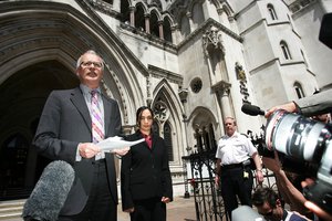 File - Solicitor Phil Shiner, left, with his collegue Solicitor Gita Parihar, of Public Interest Lawyers who represent Iraqi civilian Baha Musa, who was killed in custody, and others Iraqi mistreatment by British soldiers in Iraq, speaks to the media outside the High Court in London, Wednesday, July 20, 2005.