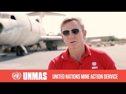 UNMAS Global Advocate Daniel Craig walks through live minefield