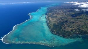 View from the top: Turquoise lagoon with saltwater channels and white sandy beach.